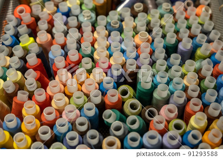 Colored thread for sewing. Threads in spools tape measure, needle bar. Colored thread for sewing. Threads in spools tape measure, needle bar. 91293588