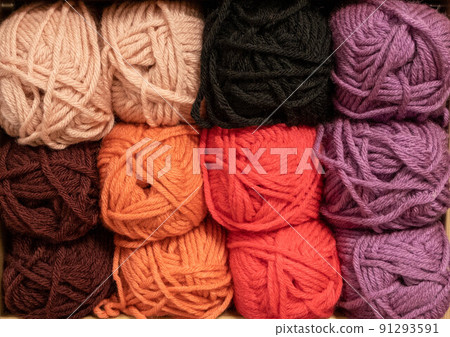 Close Up of yarn balls. Rainbow colors. Yarn for knitting. Skeins of yarn. Knitting needles, colorful threads. Knitting background, Knitting yarn for handmade winter clothes Close Up of yarn balls. Rainbow colors. Yarn for knitting. Skeins of yarn. Knitting needles, colorful threads. Knitting background, Knitting yarn for handmade winter clothes 91293591
