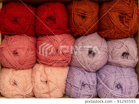 Close Up of yarn balls. Rainbow colors. Yarn for knitting. Skeins of yarn. Knitting needles, colorful threads. Knitting background, Knitting yarn for handmade winter clothes 91293593