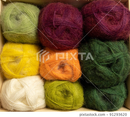 Close Up of yarn balls. Rainbow colors. Yarn for knitting. Skeins of yarn. Knitting needles, colorful threads. Knitting background, Knitting yarn for handmade winter clothes 91293620