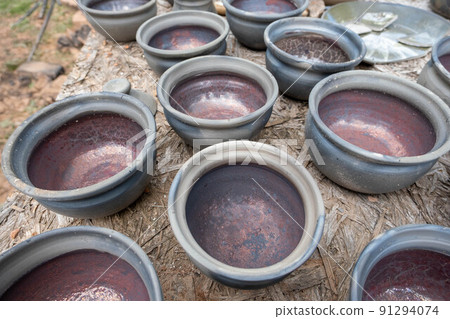 fired earthenware removed from the kiln. Mugs, pots, plates and everything else beautiful and useful. Latvian national cultural heritage 91294074