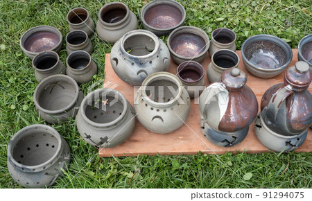 fired earthenware removed from the kiln. Mugs, pots, plates and everything else beautiful and useful. Latvian national cultural heritage. fired earthenware removed from the kiln. Mugs, pots, plates and everything else beautiful and useful. Latvian national cultural heritage. 91294075