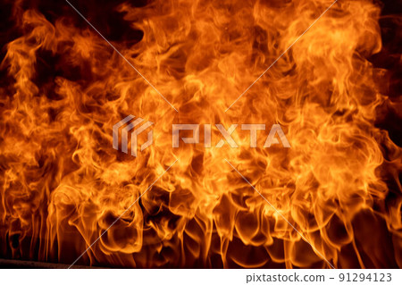 Flames. Firewood firing is part of the black ceramic process. Unique hand-made pots and pans made of clay that turn black after roasting and oxygen reduction in a wood-burning stove. Flames. Firewood firing is part of the black ceramic process. Unique hand-made pots and pans made of clay that turn black after roasting and oxygen reduction in a wood-burning stove. 91294123