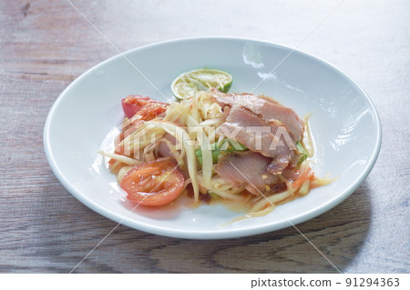 Som tum Thai spicy green papaya topping slice barbecue pork salad on plate   91294363