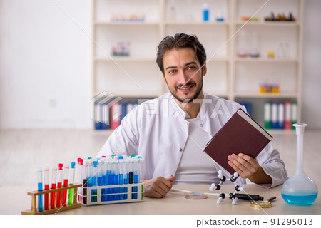 Young male chemist working at the lab Young male chemist working at the lab 91295013