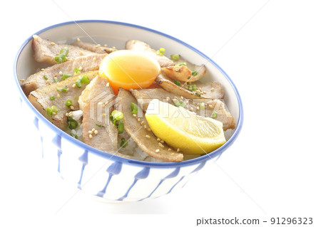 Pork toro bowl with cut lemon and egg yolk, grilled meat bowl photographed on a white background 91296323