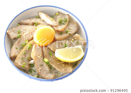 A bird's-eye view of a pork bowl with cut lemon and egg yolk and a grilled meat bowl on a white background A bird's-eye view of a pork bowl with cut lemon and egg yolk and a grilled meat bowl on a white background 91296495