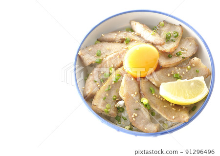 A bird's-eye view of a pork bowl with cut lemon and egg yolk and a grilled meat bowl on a white background 91296496