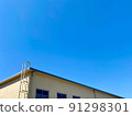 The rooftop of the school building and the blue sky 91298301