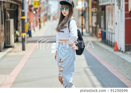 Gen Z women standing looking at the camera 91298896