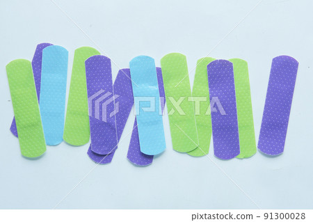 colorful adhesive bandage on white background colorful adhesive bandage on white background 91300028