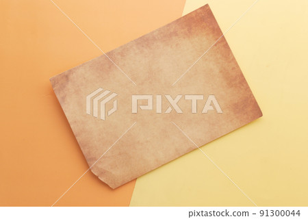 old vintage paper on color background close up  91300044
