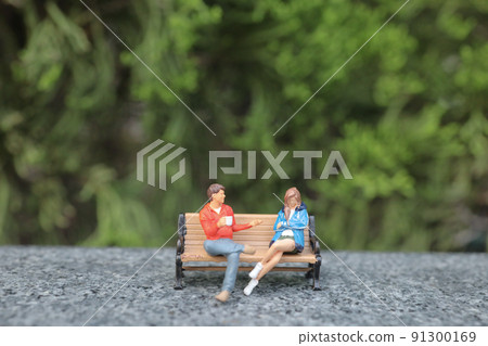 a mini figure chatting on park bench a mini figure chatting on park bench 91300169