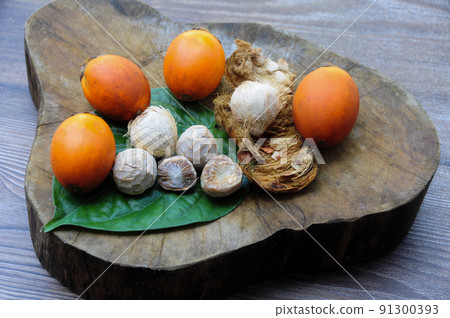 Betel nut with betel leaf isolated on wooden background. Copy space Betel nut with betel leaf isolated on wooden background. Copy space 91300393