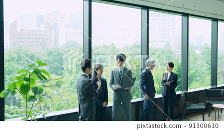 Business group talking in the lobby Business group talking in the lobby 91300610