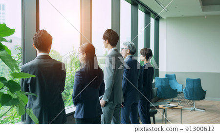 Business group looking out from the office Business group looking out from the office 91300612