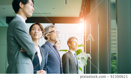 Business group looking out the window Business group looking out the window 91300621