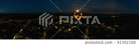 Image of illuminated Muenzenberg castle ruin in Germany in the evening Image of illuminated Muenzenberg castle ruin in Germany in the evening 91302100