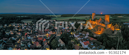 Image of illuminated Muenzenberg castle ruin in Germany in the evening Image of illuminated Muenzenberg castle ruin in Germany in the evening 91302174