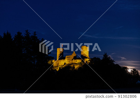 Image of illuminated Muenzenberg castle ruin in Germany in the evening Image of illuminated Muenzenberg castle ruin in Germany in the evening 91302806