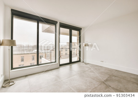 Plastic window and white wall in empty light room at home Plastic window and white wall in empty light room at home 91303434