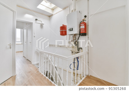 From above built in burner of gas stove installed on marble counter in kitchen 91305268