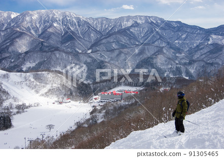 Hotel and blue sky seen from Hakuba Cortina Ski Resort's Hieda Forest Course in Otari Village, Kita Azumino County, Nagano Prefecture Hotel and blue sky seen from Hakuba Cortina Ski Resort's Hieda Forest Course in Otari Village, Kita Azumino County, Nagano Prefecture 91305465