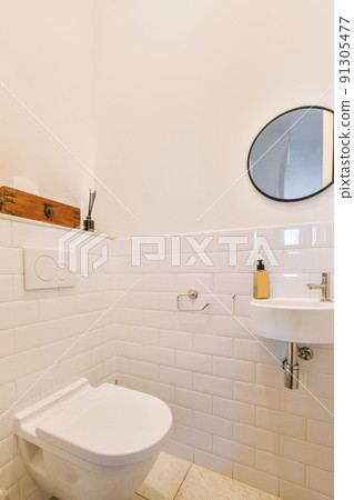 Interior of small clean restroom in miniature style Interior of small clean restroom in miniature style 91305477