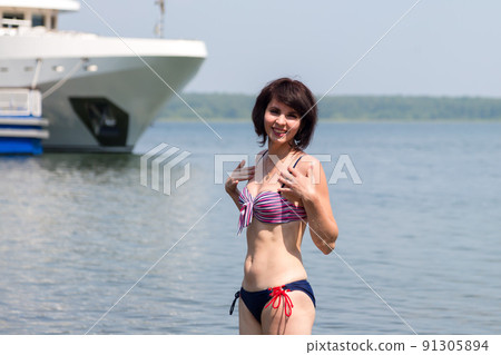 Rest of a European tourist on the seashore Rest of a European tourist on the seashore 91305894