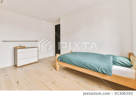Comfortable bed without ornamental blanket, near window and wardrobe in light bedroom Comfortable bed without ornamental blanket, near window and wardrobe in light bedroom 91306393