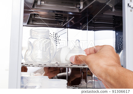 sanitizing the baby things in UV Sterilizer sanitizing the baby things in UV Sterilizer 91306617