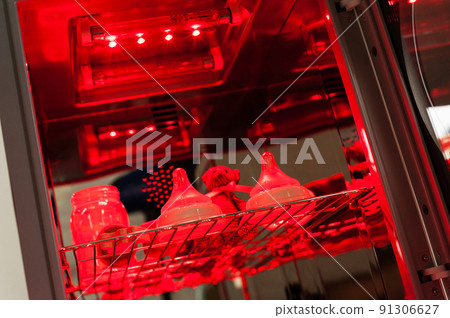 sanitizing the baby things in UV Sterilizer sanitizing the baby things in UV Sterilizer 91306627