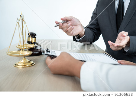 Male lawyer or notary working consulting and discussion to businesswoman client in the office, Law and Legal services concept Male lawyer or notary working consulting and discussion to businesswoman client in the office, Law and Legal services concept 91306638