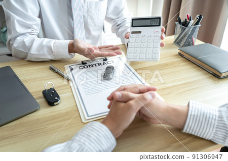 Car dealer manager presenting customer to decision signing car document contract agreement, successful car loan contract buying or selling new vehicle and pointing document 91306947