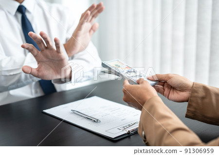 Businessman is refuses to accept banknote money and terms of contract from bribe employer in signing contract while making corruption about buy land and real estate Businessman is refuses to accept banknote money and terms of contract from bribe employer in signing contract while making corruption about buy land and real estate 91306959