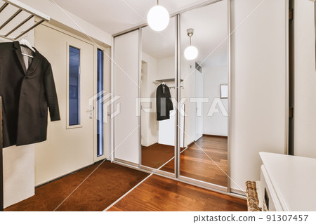 The interior of a mind-blowing entrance part of the house with a wardrobe 91307457