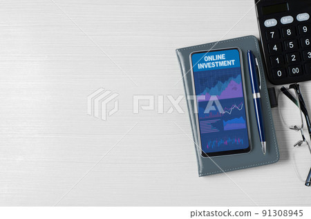Online investment. Charts and graphs on the smartphone screen. The concept of effective investment of money. Copy space Online investment. Charts and graphs on the smartphone screen. The concept of effective investment of money. Copy space 91308945