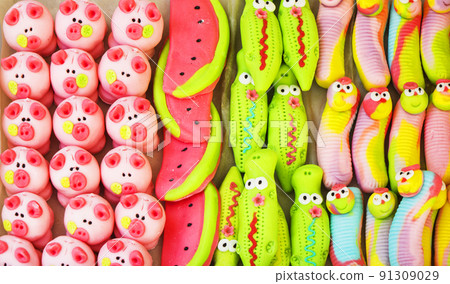 colorful chewable caramel in the form of different animals and fruits. colorful chewable caramel in the form of different animals and fruits. 91309029