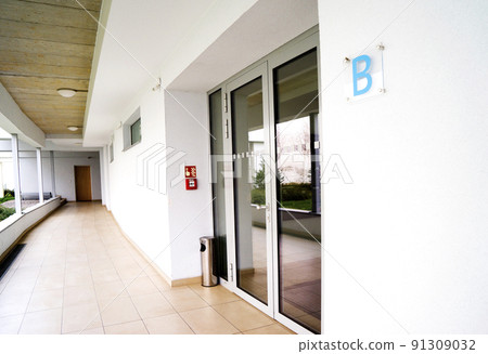 outdoor empty corridor with garden in the modern office building outdoor empty corridor with garden in the modern office building 91309032