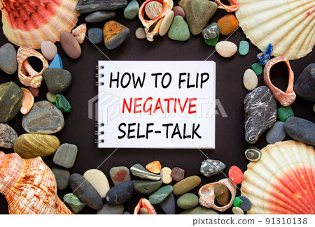 Flip negative self-talk symbol. Concept words How to flip negative self-talk on a beautiful black background. Sea stones and seashells. Psychological and flip negative self-talk concept. Copy space. Flip negative self-talk symbol. Concept words How to flip negative self-talk on a beautiful black background. Sea stones and seashells. Psychological and flip negative self-talk concept. Copy space. 91310138