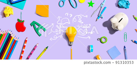 Brainstorming concept with a light bulb and school supplies Brainstorming concept with a light bulb and school supplies 91310353