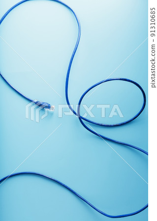Blue UTP Internet Cable Isolated on a blue background Ethernet Cord Blue UTP Internet Cable Isolated on a blue background Ethernet Cord 91310685