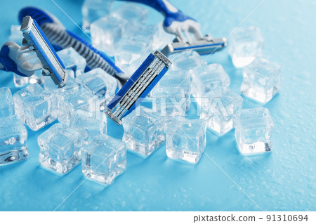 Refreshing shaving machines for the face against the background of frosty ice cubes Refreshing shaving machines for the face against the background of frosty ice cubes 91310694