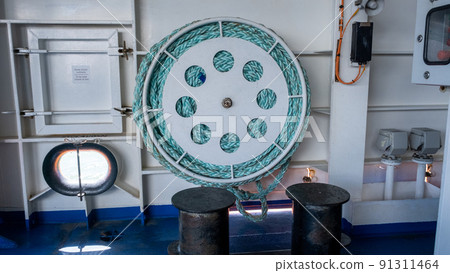 Green ship's rope wrapped on board a passenger ferry Green ship's rope wrapped on board a passenger ferry 91311464