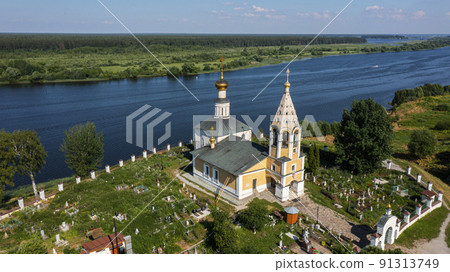 Aerial survey of the Cathedral of the Blessed Virgin Mary in the village of Gorodnya in the Tver region in Russia. One of the oldest churches in Russia. Aerial view Aerial survey of the Cathedral of the Blessed Virgin Mary in the village of Gorodnya in the Tver region in Russia. One of the oldest churches in Russia. Aerial view 91313749