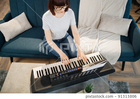 Close up of hand of caucasian girl playin piano. Close up of hand of caucasian girl playin piano. 91313806