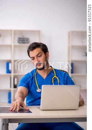 Young male doctor radiologist working in the clinic 91317325