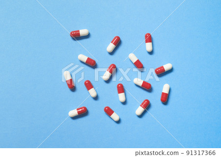 Pharmaceutical capsules over blue background. Pharmaceutical capsules over blue background. 91317366