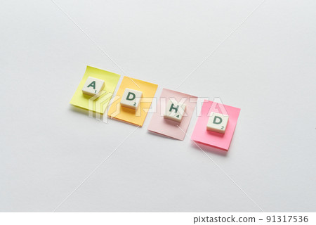 ADHD formed of scrabble blocks on sticky notes. ADHD formed of scrabble blocks on sticky notes. 91317536
