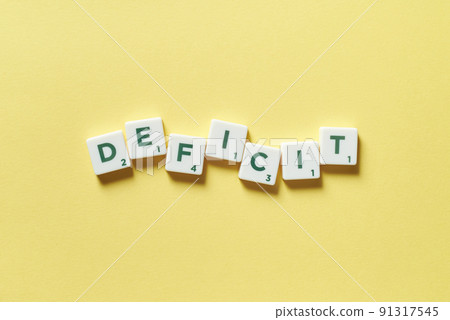 Deficit formed of scrabble tiles. Deficit formed of scrabble tiles. 91317545